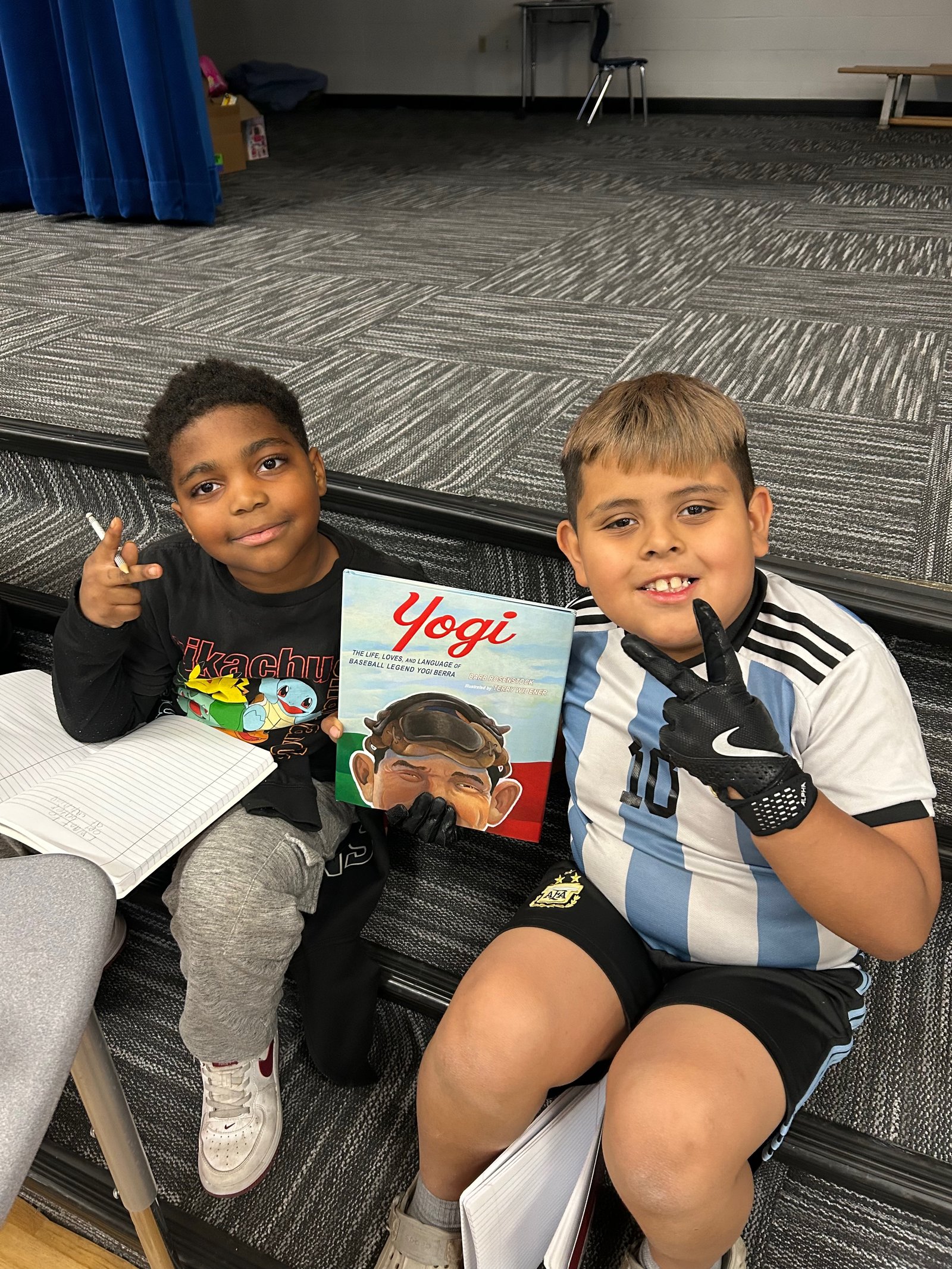 Players reading a book together during an NJRL classroom session